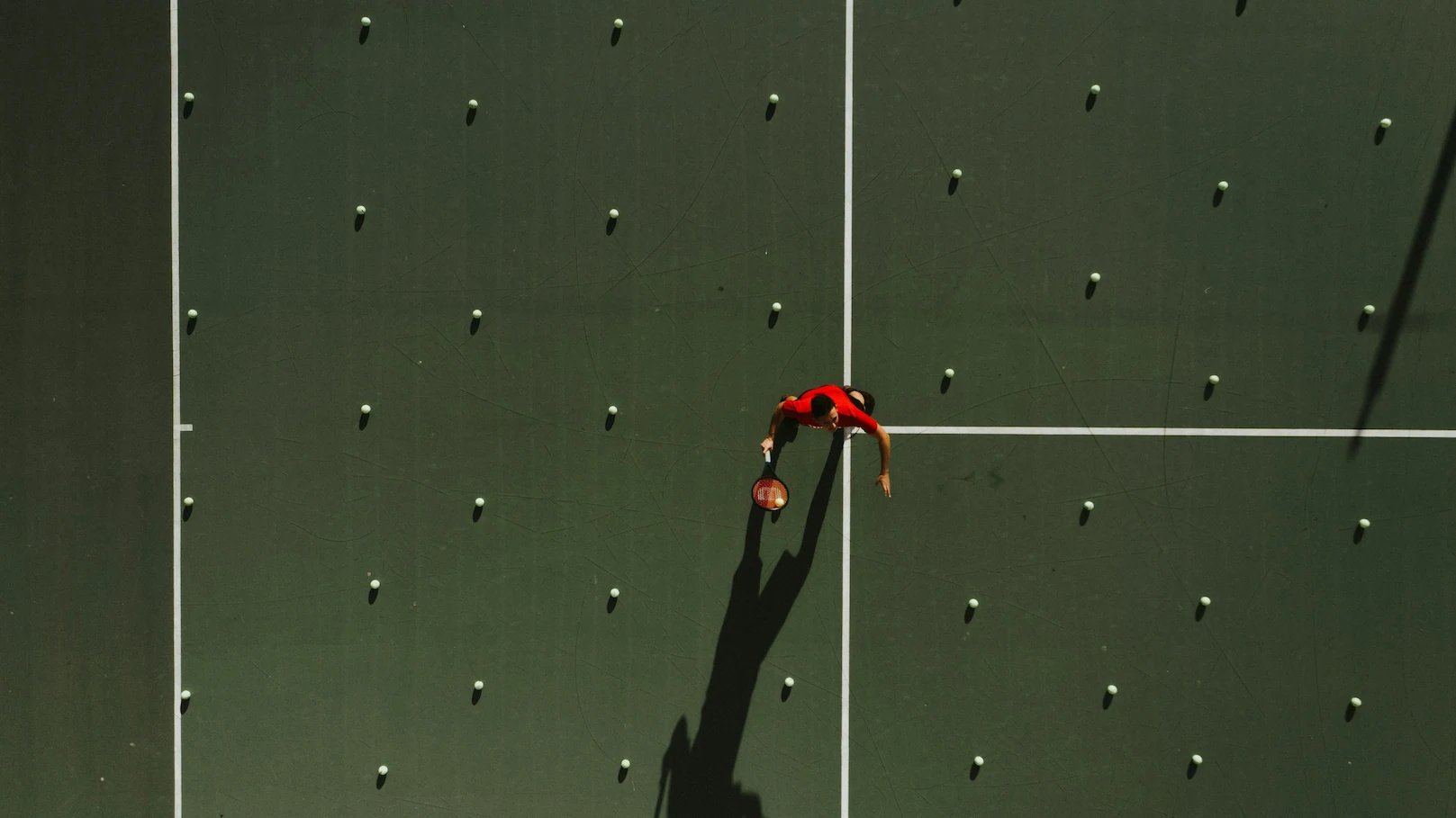 Aerial shot of a tennis player preparing to hit a shot during a private lesson