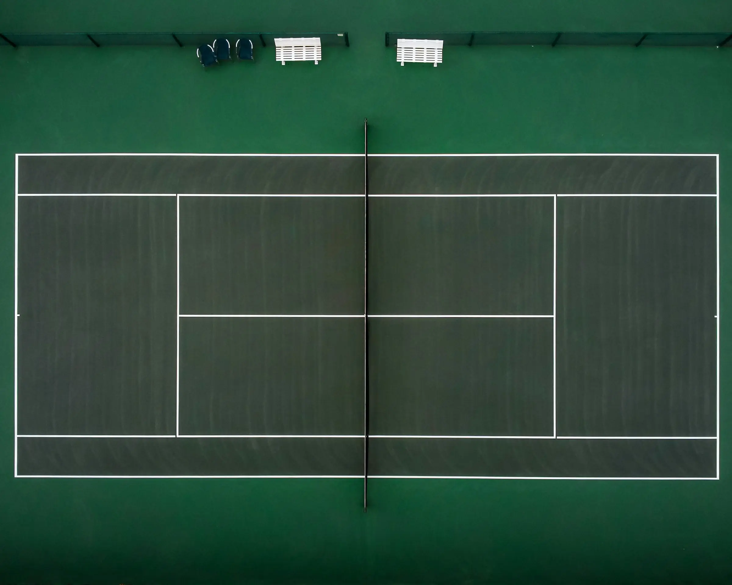 Aerial view of the pristine hard courts at McLeland Tennis Center in Fort Worth
