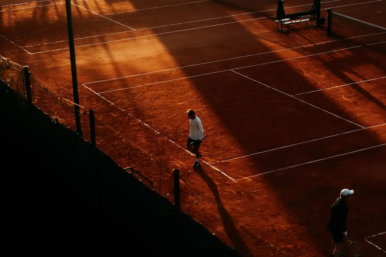 Multiple tennis matches happening simultaneously during a league night in Phoenix