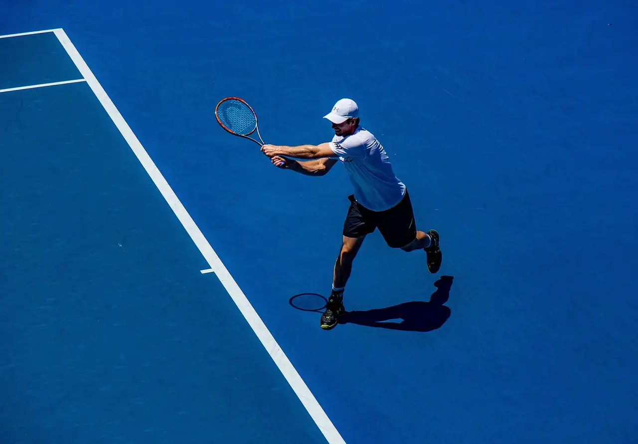 A competitive tennis player serving during a match in Philadelphia