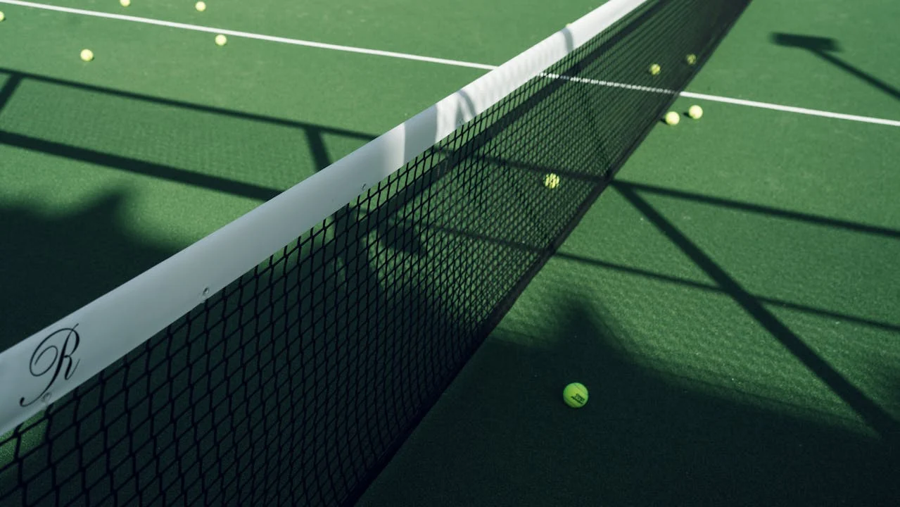 The pristine hard courts at a public park in Charlotte, NC surrounded by trees