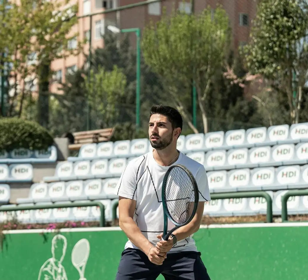 Coach Ryan, a Fort Worth tennis instructor demonstrating solid technique during a private lesson.