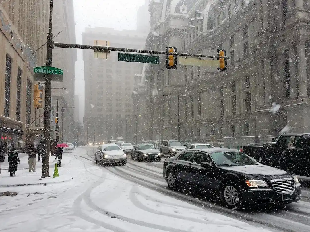 A snowy Philadelphia skyline, highlighting the need for indoor pickleball facilities during winter