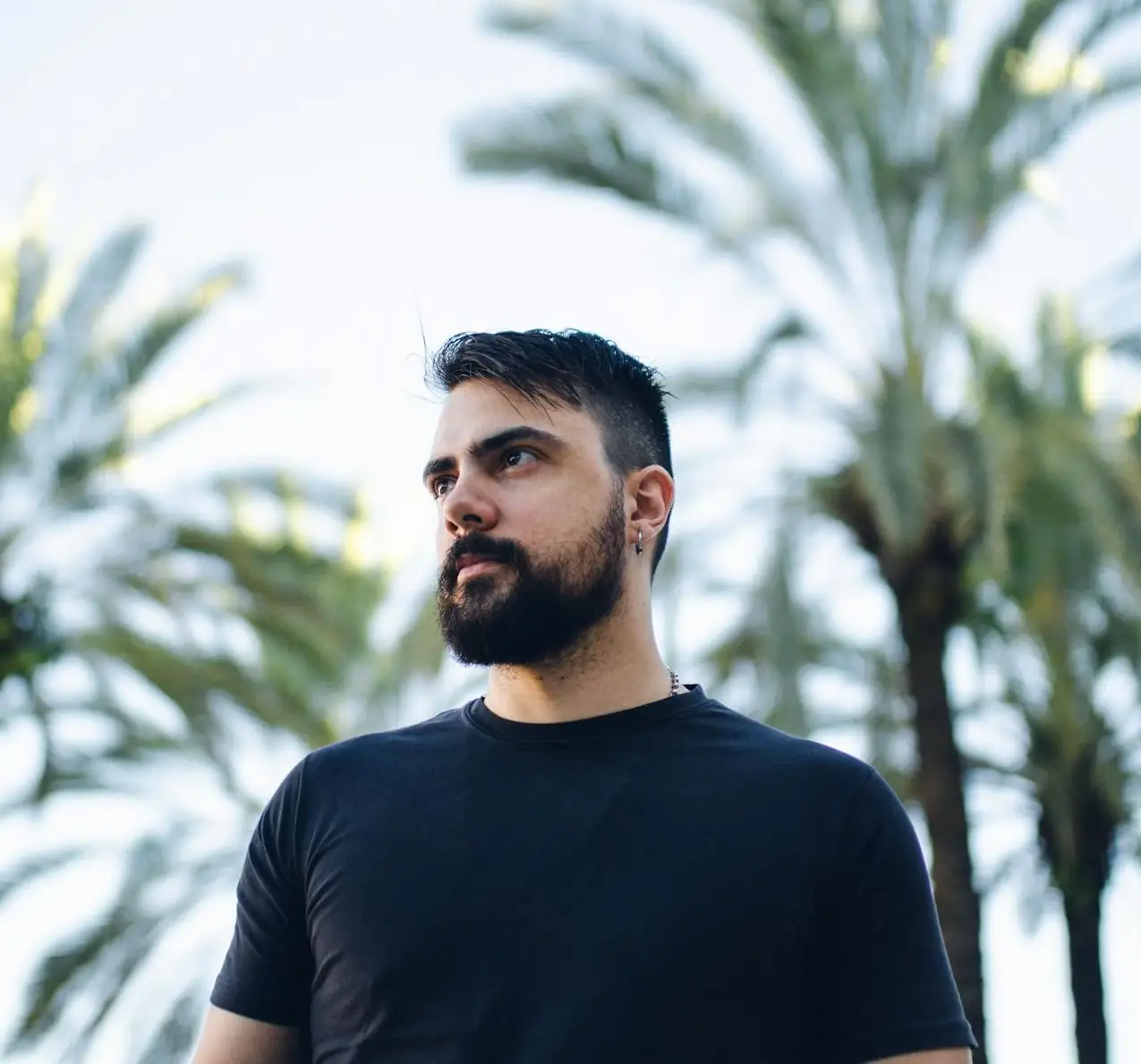 Coach Ethan, private tennis coach in Dallas, Texas, focused during a mobile lesson at a local court.