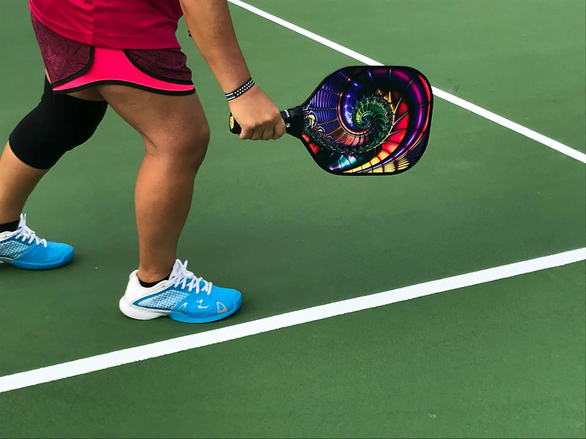 A pickleball player's shoes on the court at a local public park in Delray Beach, capturing the casual pickup game vibe