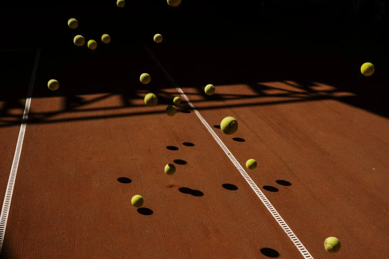 Tennis balls cascading onto a pristine hard court in Atlanta