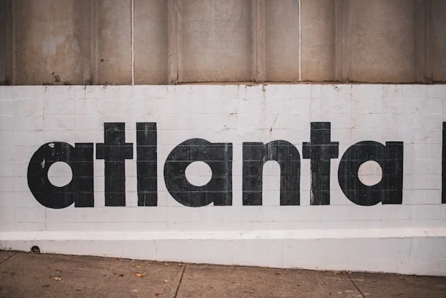 Atlanta typography on a white wall representing the city's tennis culture